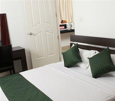 Asset Summit Suites в Kochi, IN